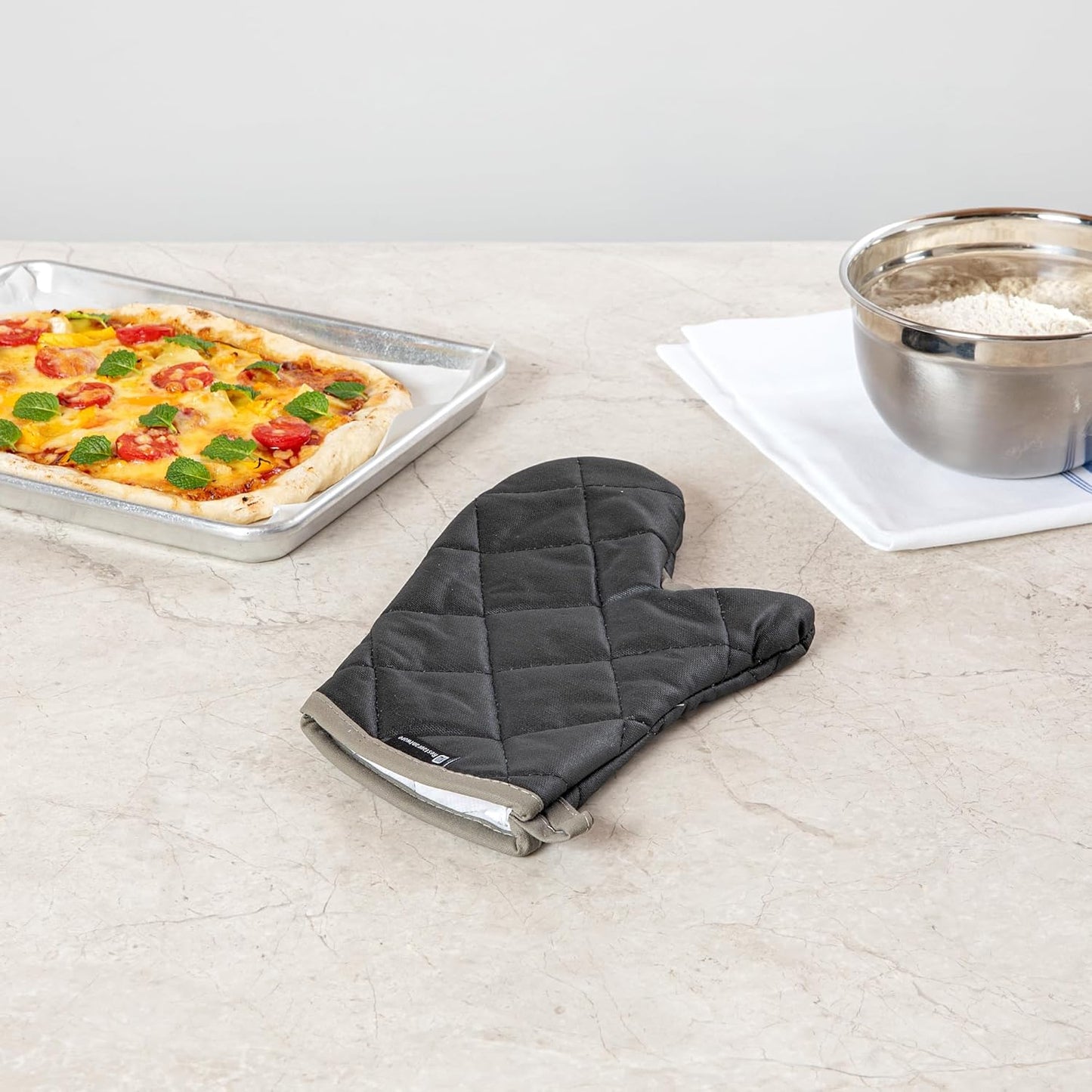 Restaurantware 13.7 x 8 Inch Heavy-Duty Oven Mitt 1 Flame Retardant Heat-Resistant Kitchen Glove - With Thumb Guard Hanging Loop Black Cotton Quilted Glove Heat-Resistant For Cooking And Baking